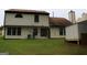 Back exterior of home with a large yard, patio, and a shed on blocks at 3255 Hunters Crossing Pt, Lithonia, GA 30038