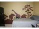 Bedroom features a gray bedspread and art on the walls at 3255 Hunters Crossing Pt, Lithonia, GA 30038