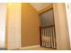 Hallway featuring a wood railing with white spindles and a cream carpet at 3255 Hunters Crossing Pt, Lithonia, GA 30038