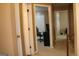 Hallway featuring doorways and a wood railing at 3255 Hunters Crossing Pt, Lithonia, GA 30038