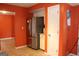 Kitchen area features stainless steel refrigerator, white cabinets, and adjacent doorway at 3255 Hunters Crossing Pt, Lithonia, GA 30038