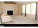 Open-concept living room with light colored sofa, fireplace, and large windows at 3255 Hunters Crossing Pt, Lithonia, GA 30038