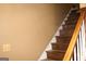 Staircase featuring wood steps and railing with white spindles at 3255 Hunters Crossing Pt, Lithonia, GA 30038
