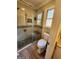 Beautiful bathroom featuring a stand up shower, tiled walls, and tiled flooring at 6340 Koweta Rd, Fairburn, GA 30213