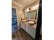 Bathroom featuring double sinks and a spacious shower at 6340 Koweta Rd, Fairburn, GA 30213
