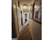 Hallway with carpet, storage, neutral paint, and decorated with framed art at 6340 Koweta Rd, Fairburn, GA 30213