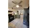 Kitchen with stainless steel appliances, granite counters, and a tile floor offers a blend of style and functionality at 6340 Koweta Rd, Fairburn, GA 30213
