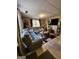 Living room featuring wood laminate flooring, and a large gray couch at 6340 Koweta Rd, Fairburn, GA 30213