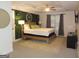 Spacious bedroom with a large bed, ceiling fan, and TV at 2958 Mary Alice Trl, Loganville, GA 30052