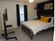 This bedroom features a rustic wood-paneled bed with black and yellow decor at 2958 Mary Alice Trl, Loganville, GA 30052