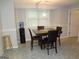 Cozy dining area featuring a wooden table with four chairs and a water cooler at 2958 Mary Alice Trl, Loganville, GA 30052