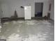 The unfinished garage is partially filled, containing a refrigerator at 2958 Mary Alice Trl, Loganville, GA 30052