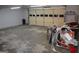 This garage has unfinished floors and features an automatic garage door at 2958 Mary Alice Trl, Loganville, GA 30052