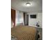 This comfortable bedroom with natural light has brown and white curtains at 6205 Littleton Dr, Union City, GA 30291