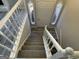The stairway has a beautiful white railing and tiled landing at 6205 Littleton Dr, Union City, GA 30291