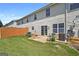 A well-maintained backyard with green grass, a fence, and a patio at 695 Georgetown Ct, Jonesboro, GA 30236