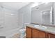 Bathroom featuring a tub and shower combo, toilet, and granite vanity at 695 Georgetown Ct, Jonesboro, GA 30236