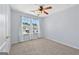 Bedroom featuring a ceiling fan, carpet, and natural light at 695 Georgetown Ct, Jonesboro, GA 30236