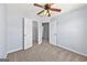 Cozy bedroom featuring a ceiling fan, carpet, and a closet at 695 Georgetown Ct, Jonesboro, GA 30236