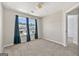 Bedroom with carpet flooring, light-colored walls, and two windows at 695 Georgetown Ct, Jonesboro, GA 30236