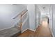 Hallway with hardwood floors, a staircase and a closet and views into the living room at 695 Georgetown Ct, Jonesboro, GA 30236