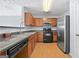 Modern kitchen featuring stainless steel appliances and beautiful wood cabinets at 695 Georgetown Ct, Jonesboro, GA 30236
