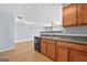 An open kitchen with a countertop, dishwasher, and a view of the dining area at 695 Georgetown Ct, Jonesboro, GA 30236