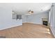Living room with hardwood floors, a fireplace, and modern ceiling fan at 695 Georgetown Ct, Jonesboro, GA 30236
