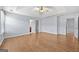 Bright primary bedroom featuring a trey ceiling, ceiling fan, and multiple closets at 695 Georgetown Ct, Jonesboro, GA 30236