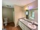 Large bathroom featuring a double sink vanity, bathtub, and toilet, providing ample space and functionality at 270 Mountain Way, Covington, GA 30016