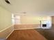 Spacious living room with a fireplace and a combination of carpet and wood flooring, creating a cozy atmosphere at 270 Mountain Way, Covington, GA 30016