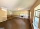 Cozy living room with a fireplace and built-in shelves, offering a warm and inviting atmosphere at 270 Mountain Way, Covington, GA 30016