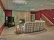 Finished basement with a cozy seating area, a fireplace, and a staircase, ideal for relaxation and entertainment at 307 Worthing Ln, Mcdonough, GA 30253