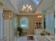 Bright bathroom featuring a large tub, glass enclosed shower and skylight at 307 Worthing Ln, Mcdonough, GA 30253