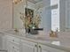 Elegant bathroom featuring double sinks, white cabinets, and decorative fixtures, perfect for modern living at 307 Worthing Ln, Mcdonough, GA 30253
