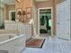Bathroom featuring a large tub and vanity with a view of main bedroom at 307 Worthing Ln, Mcdonough, GA 30253