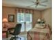 Cozy bedroom featuring a ceiling fan, a window with blinds, and a comfortable bed, creating a relaxing atmosphere at 307 Worthing Ln, Mcdonough, GA 30253