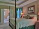Comfortable main bedroom suite featuring a four poster bed and ensuite bath at 307 Worthing Ln, Mcdonough, GA 30253