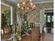 Formal dining room with a chandelier, table decor and floral wallpaper design at 307 Worthing Ln, Mcdonough, GA 30253