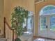 Foyer with arched doorway, decorative lighting, and an attractive plant at 307 Worthing Ln, Mcdonough, GA 30253