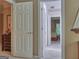 Hallway with multiple doorways leading to different rooms, providing access to various parts of the home at 307 Worthing Ln, Mcdonough, GA 30253