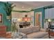 Cozy living room with a view of the kitchen and featuring plants and a comfortable couch at 307 Worthing Ln, Mcdonough, GA 30253