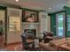 Inviting living room features built-in shelves, a fireplace, and natural lighting at 307 Worthing Ln, Mcdonough, GA 30253