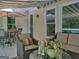Covered patio with outdoor furniture and decor, including an umbrella and potted plant at 307 Worthing Ln, Mcdonough, GA 30253