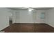 Bright living room with hardwood floors, neutral walls, ceiling fan and natural light from windows at 1581 Jersey Social Circle Rd, Covington, GA 30014