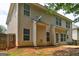 The rear of the house features light siding, and multiple windows and doors leading to the outside at 2093 Parador Bnd, Mcdonough, GA 30253
