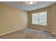 Bedroom boasts neutral walls, plush carpeting, and a large window for great lighting at 2093 Parador Bnd, Mcdonough, GA 30253