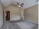 Spacious bedroom featuring vaulted ceilings, a ceiling fan, and neutral carpeting at 2093 Parador Bnd, Mcdonough, GA 30253