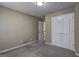 Bedroom featuring neutral paint, carpet, a ceiling light, and a double door closet at 2093 Parador Bnd, Mcdonough, GA 30253