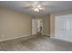 Bedroom featuring plush carpeting, neutral walls, and a double door closet at 2093 Parador Bnd, Mcdonough, GA 30253